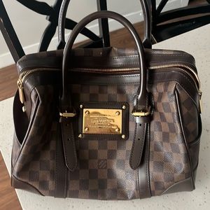 Vintage Louis Vuitton purse. Comes with bag.